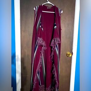 Long sweater type vest.